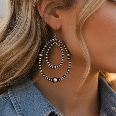 Sterling Silver earrings handcrafted by Native American artist Louisa Joe