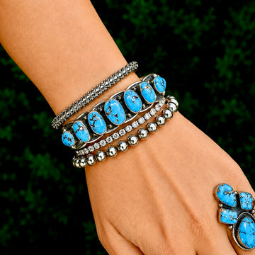 7 Stone Natural Golden Hills Turquoise cuff handcrafted by Native American artist Jereme Delgarito