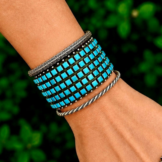 Natural Sleeping Beauty Turquoise bracelet handcrafted by Native American artist Raymond Betsoi