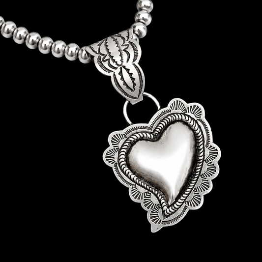 Sterling Silver pendant handcrafted by Native American artist Leander Tahe
