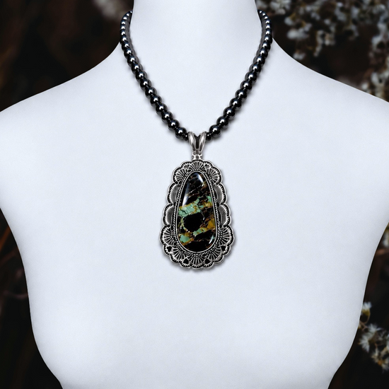 Blackjack Turquoise pendant handcrafted by Native American artist Sunshine Reeves