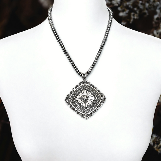 Sterling Silver pendant handcrafted by Native American artist Sunshine Reeves