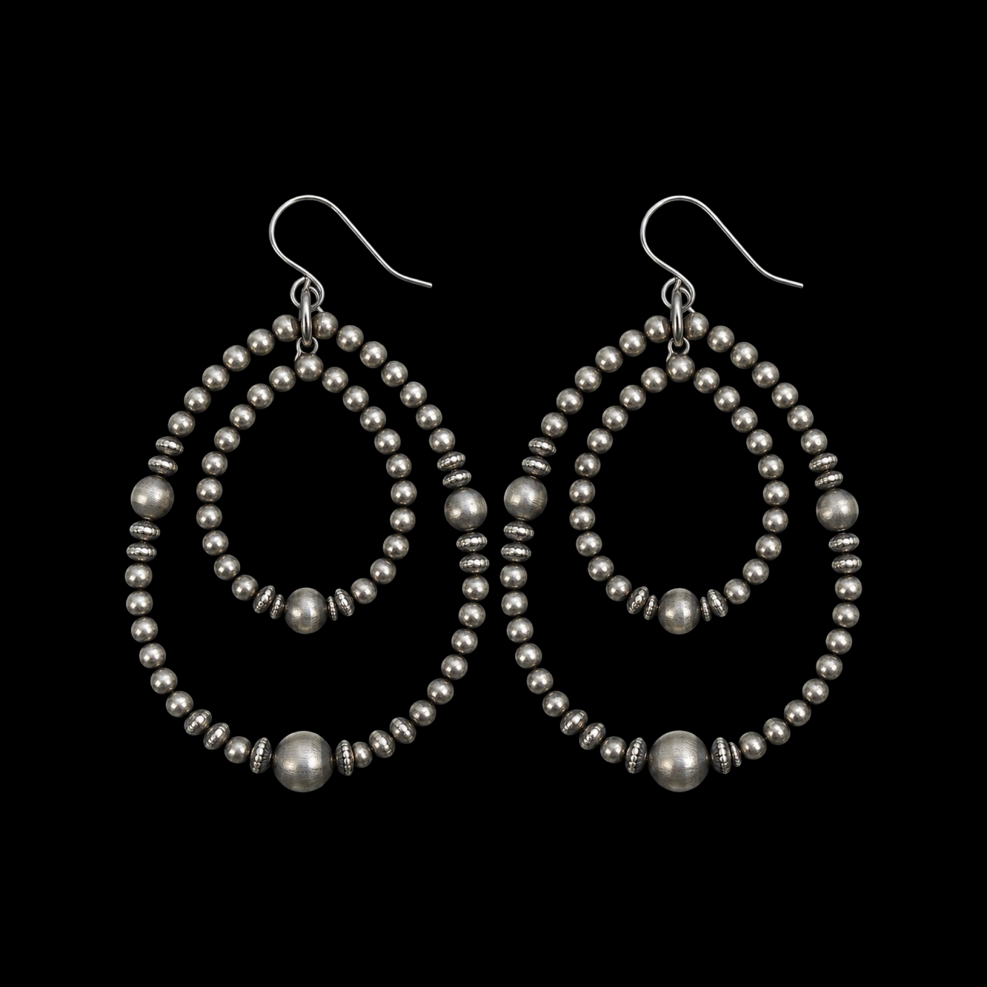 Sterling Silver earrings handcrafted by Native American artist Louisa Joe