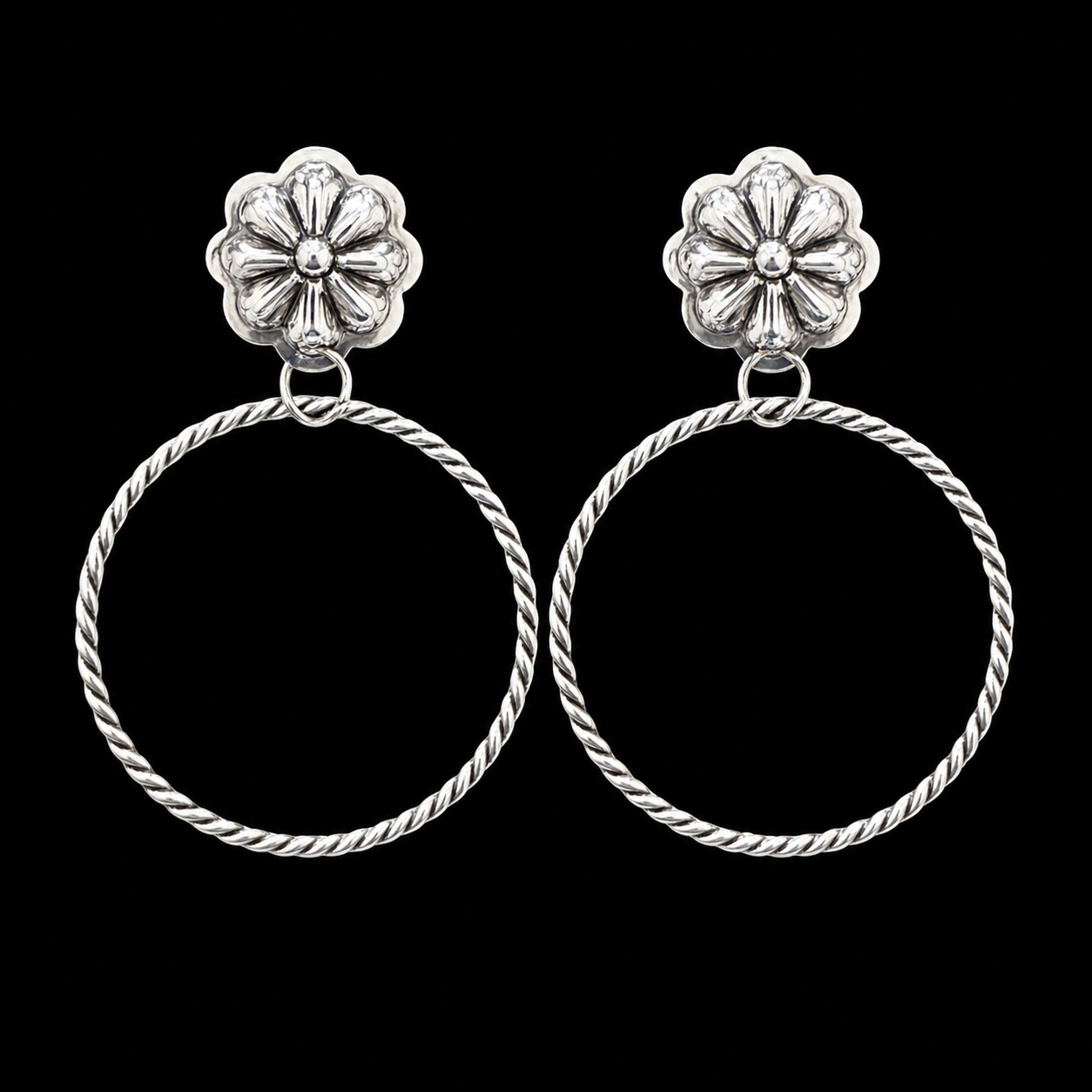 Sterling Silver earrings handcrafted by Native American artist Lavina Benally
